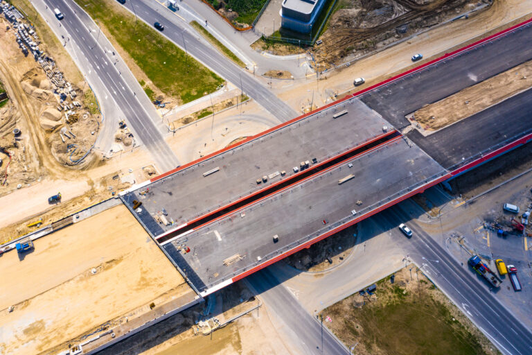 An unfinished highway still under construction, a metaphor for infrastructure asset management and capital planning.