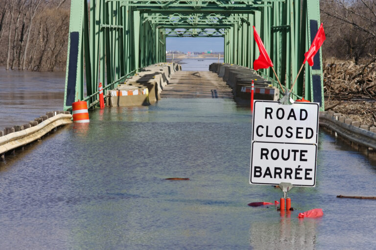 Flooded road that could have been prevented with climate-resilient infrastructure.